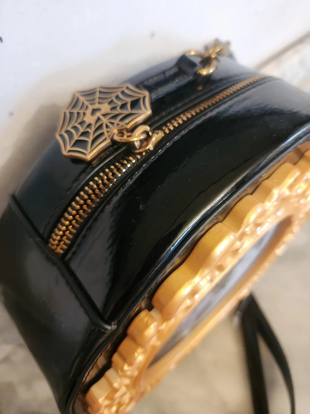 Betsey Johnson Black Oval Crossbody Bag with Gold Frame Accent